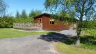 Log Cabin 7, with its spacious grounds and south facing sun deck.
