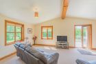 Open plan living space, log cabin with hot tub, York.